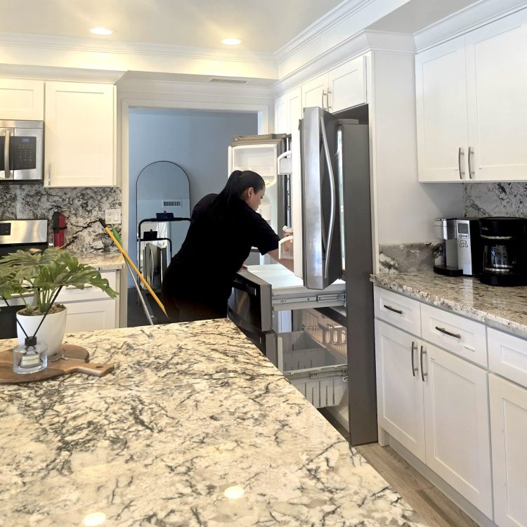 Cleaners doing Kitchen deep cleaning